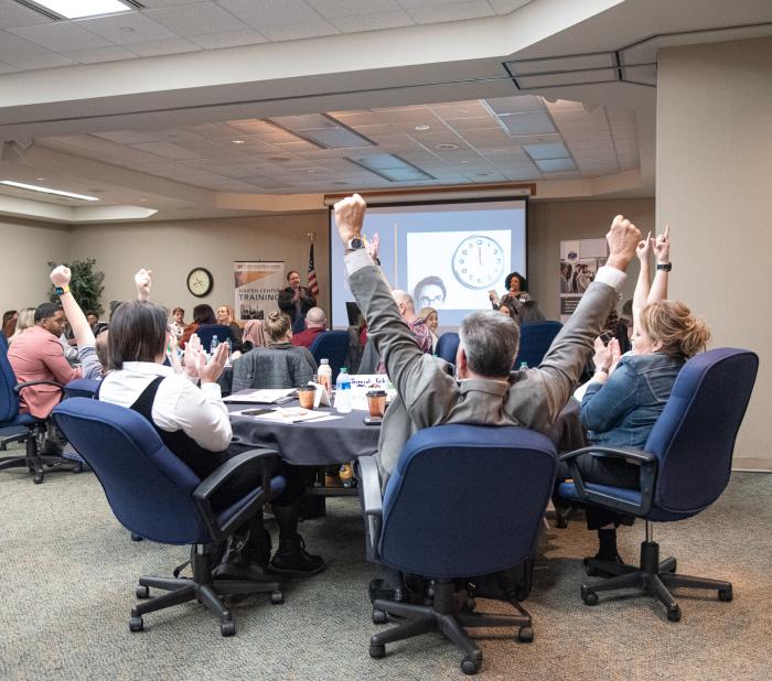 Participants try a team-building activity designed by the Naifeh Center.